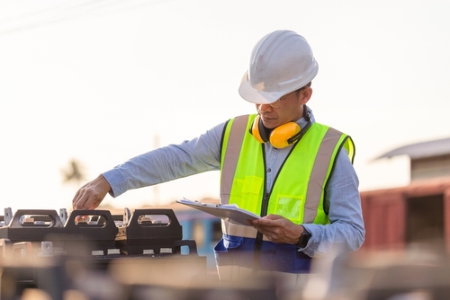 Engineer,Man,In,Waistcoats,And,Hardhats,With,Documents,Inspecting,Construction